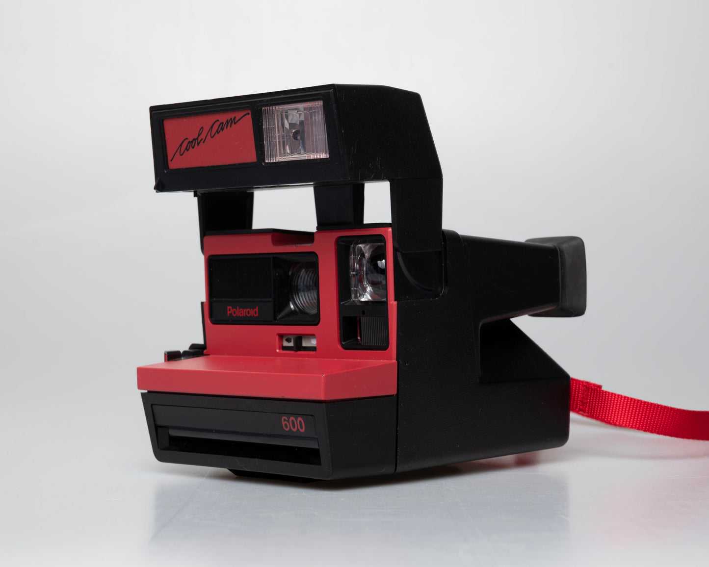 Red Polaroid 600 Cool Cam instant camera (serial F2B0850HVAC)