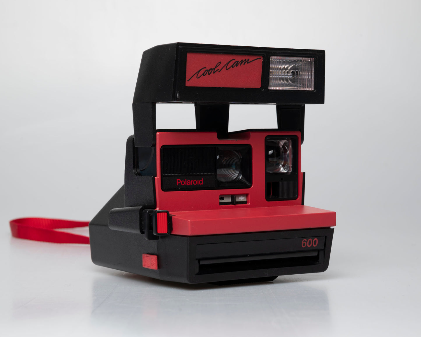 Red Polaroid 600 Cool Cam instant camera (serial F2B0850HVAC)