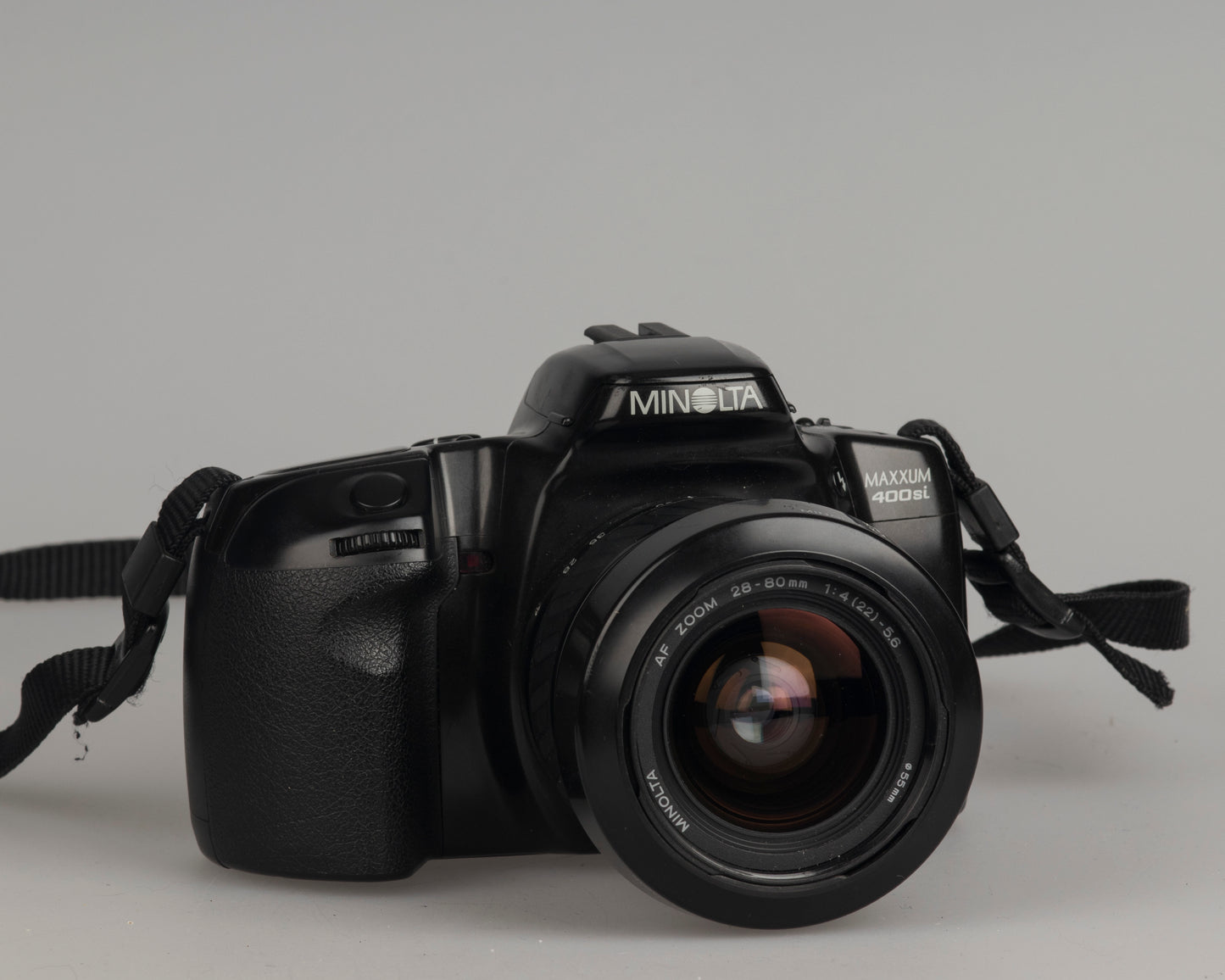 Minolta Maxxum 400si 35mm film SLR camera featuring a 28-80mm lens