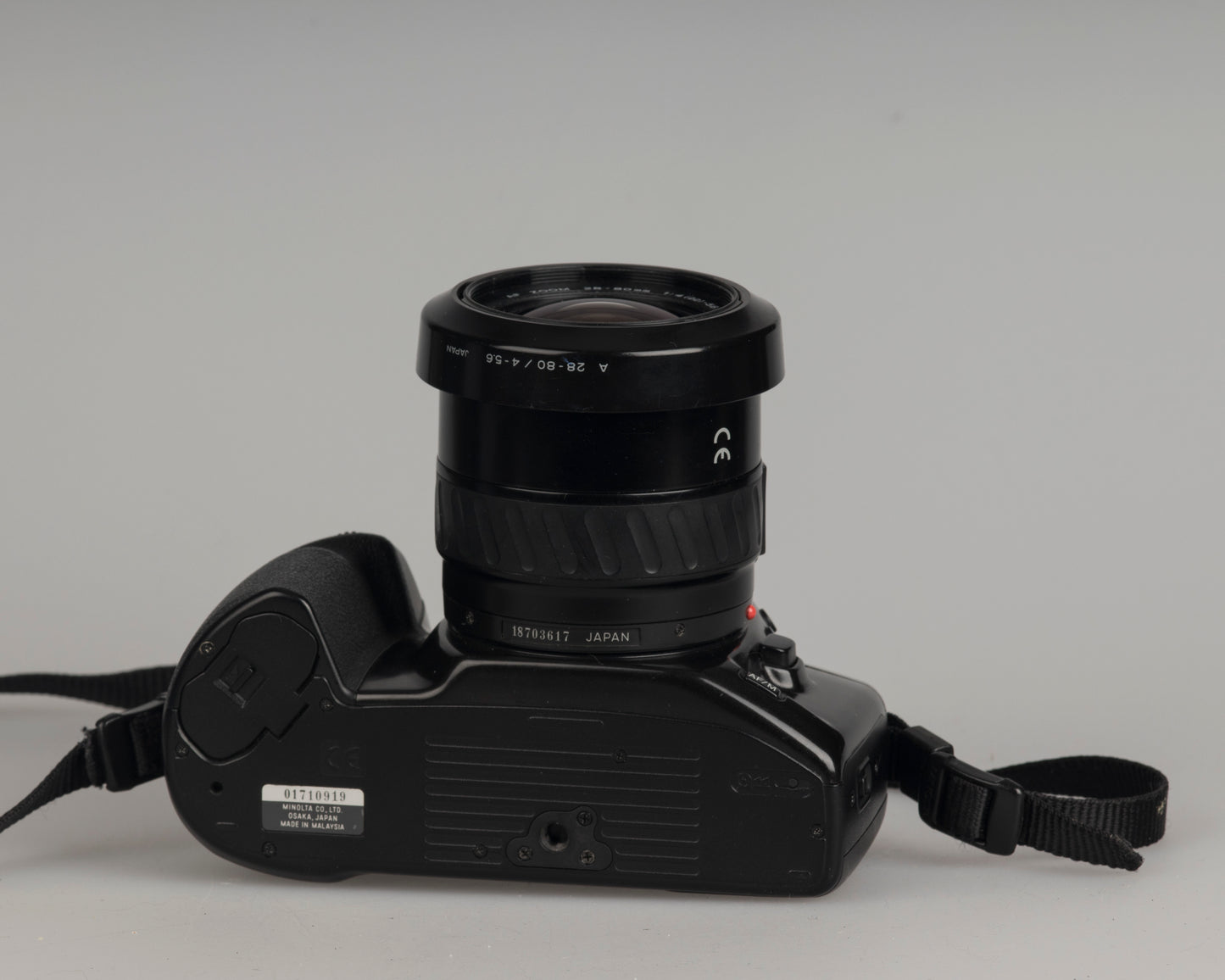 Minolta Maxxum 400si 35mm film SLR camera featuring a 28-80mm lens; bottom view