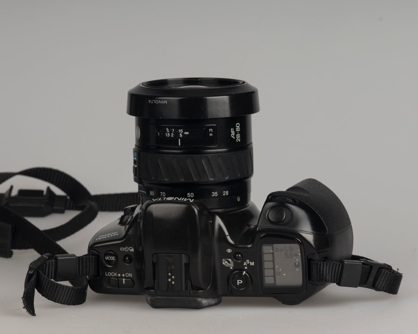 Minolta Maxxum 400si 35mm film SLR camera featuring a 28-80mm lens; top view
