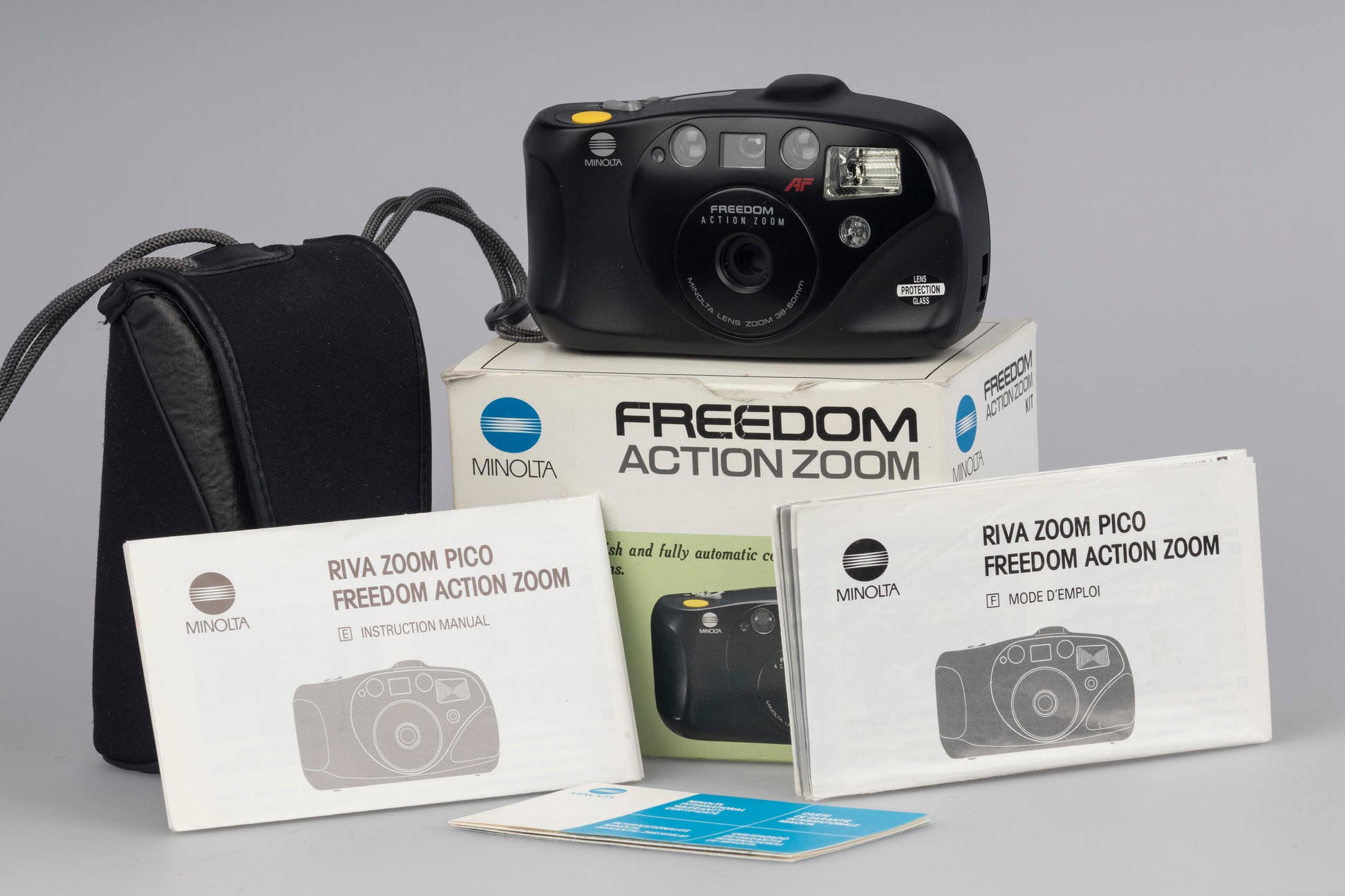 Minolta Freedom Action Zoom 35mm film camera. Shown with box and manual