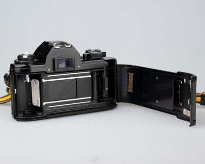 Nikon EM 35mm film SLR camera w/ 50mm f1.8 lens and 'ever-ready' case