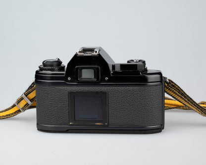 Nikon EM 35mm film SLR camera w/ 50mm lens and 'ever-ready