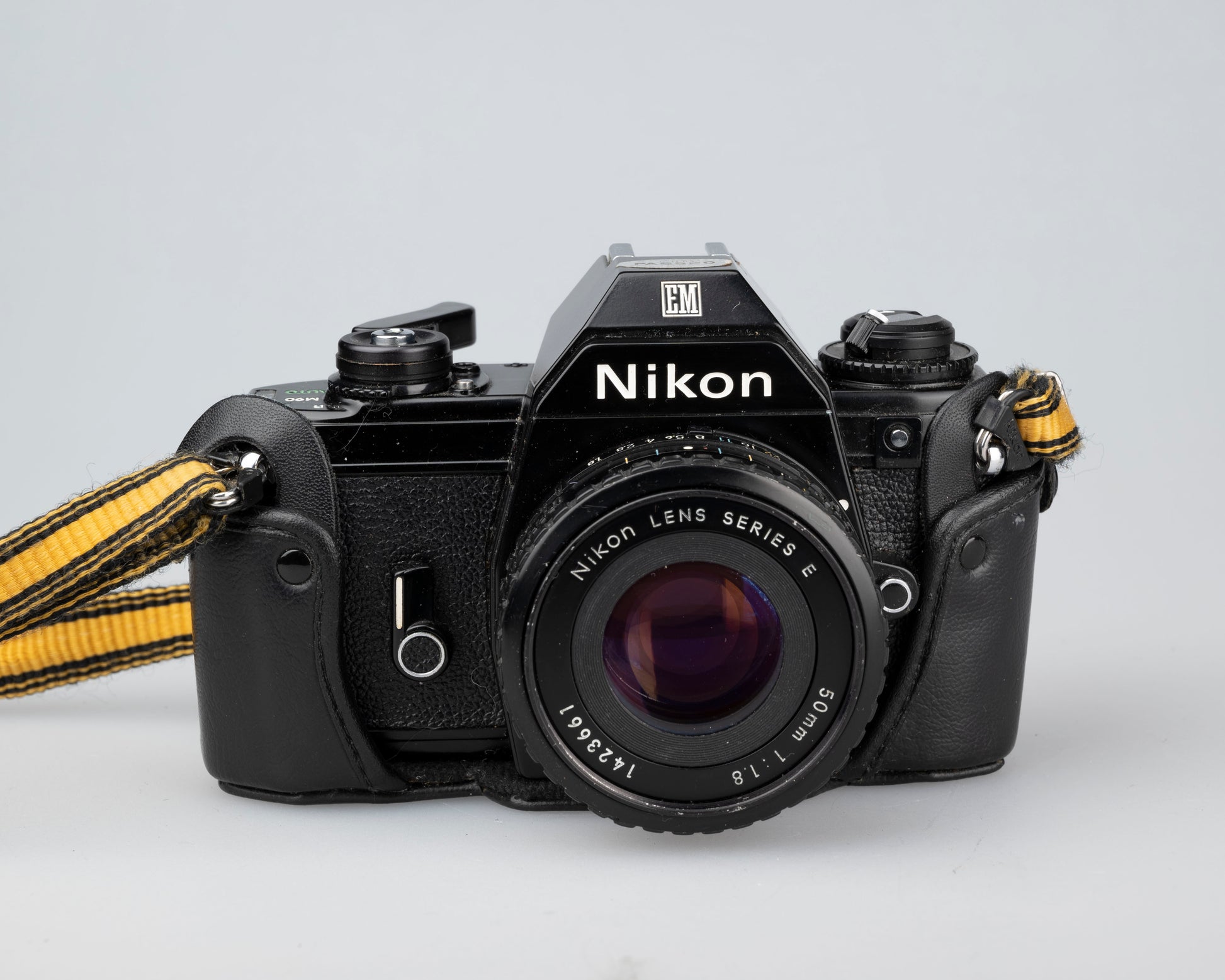 Nikon EM 35mm film SLR camera w/ 50mm lens and 'ever-ready' case