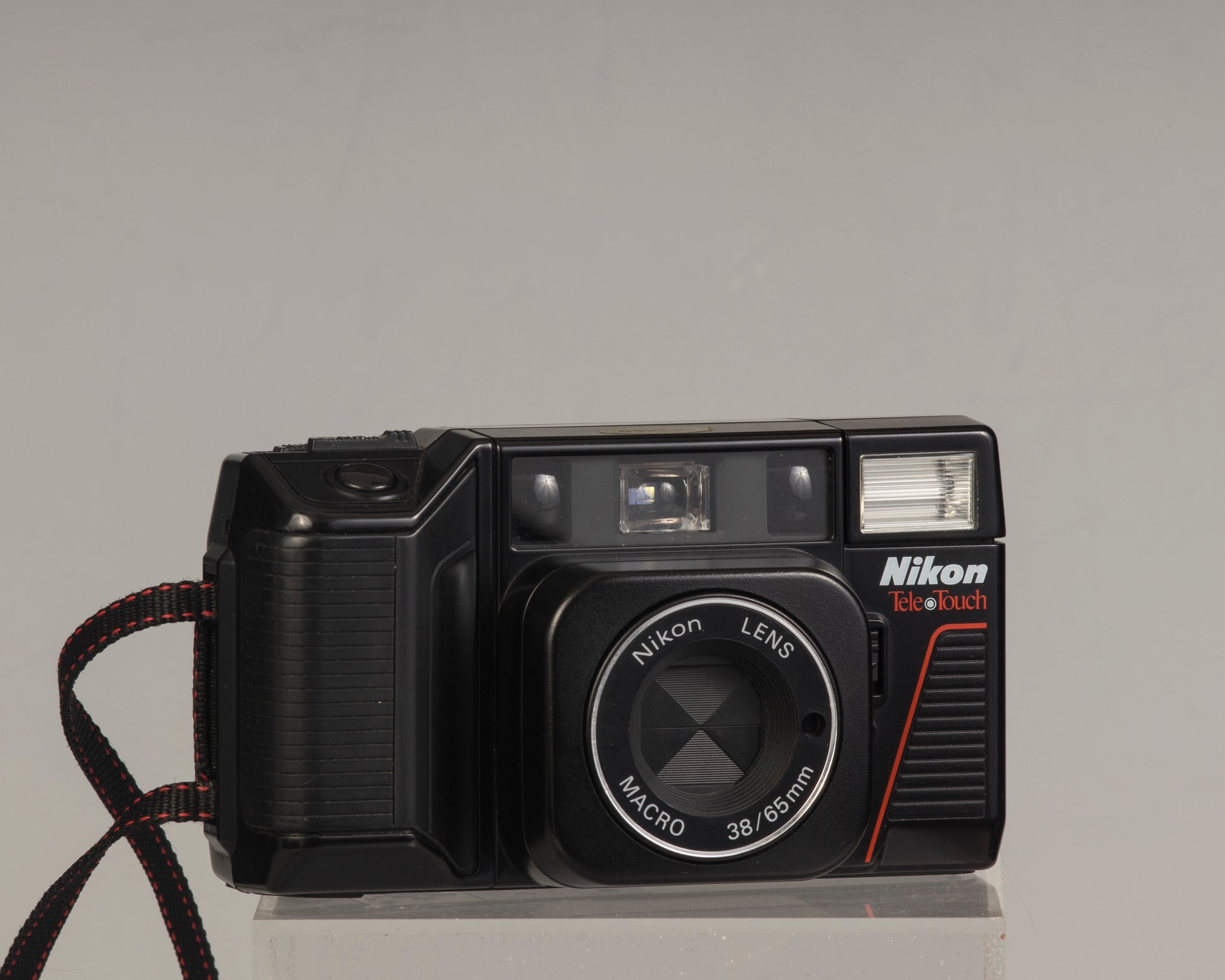 The Nikon Tele Touch (aka L35TWAF) front view switched off; this is a classic twin lens 35mm point-and-shoot camera 