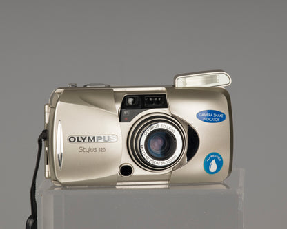 The Olympus Stylus 120 (aka Olympus mju-III 120) is advanced point-and-shoot film camera from 2003. It features a sophisticated lens with aspherical and ED glass elements.  