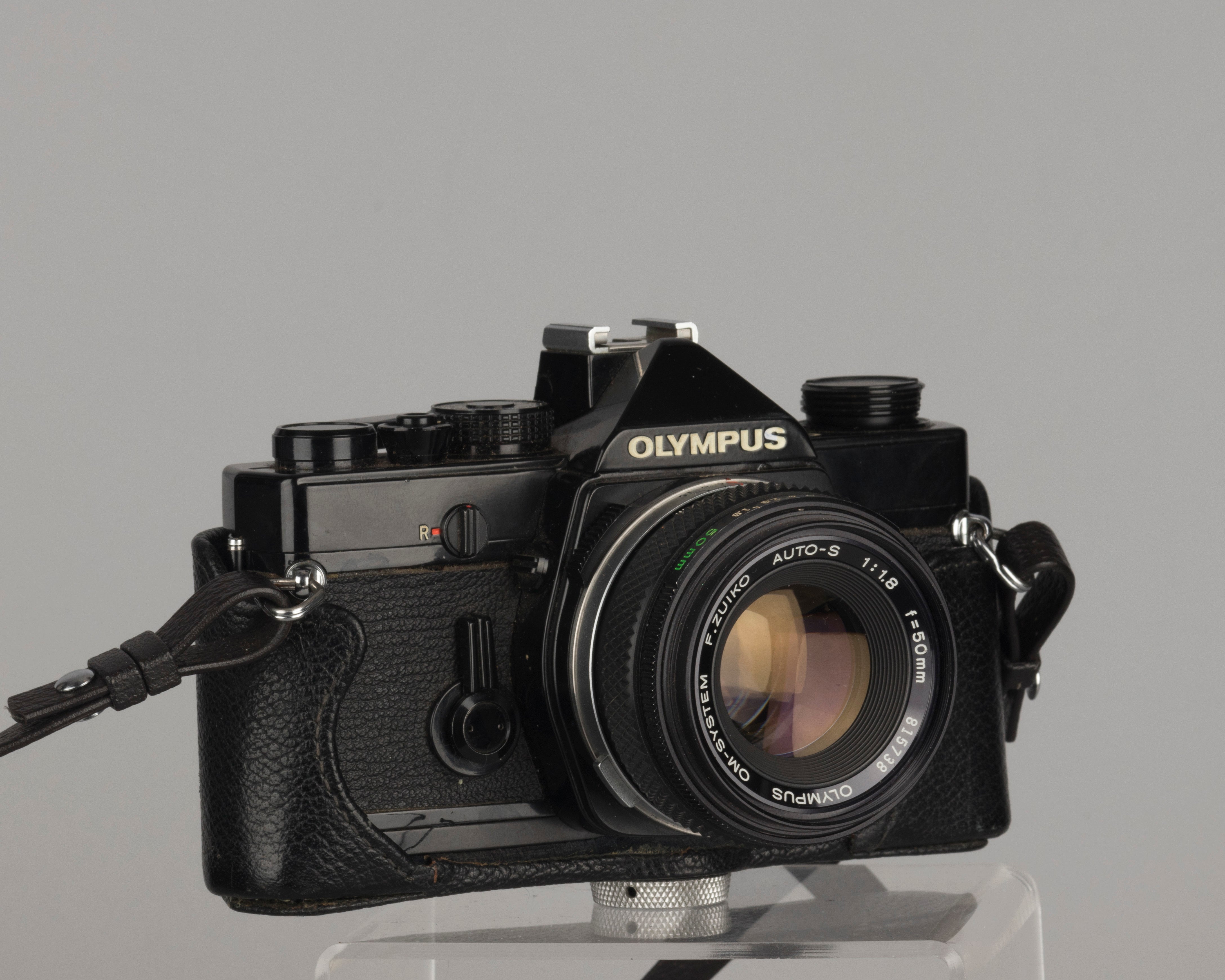 Olympus OM-1 35mm film SLR w/ Zuiko 50mm f1.8 lens and ever-ready