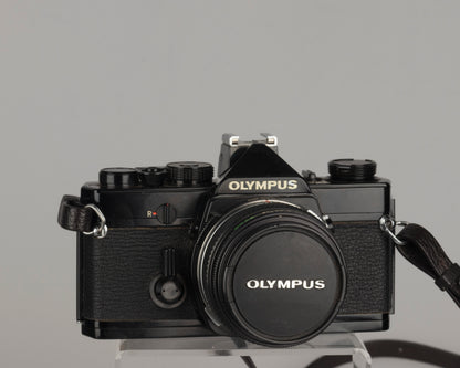 Olympus OM-1 35mm film SLR w/ Zuiko 50mm f1.8 lens and ever-ready case