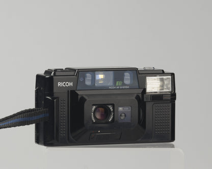 The Ricoh FF-3 AF is quality point-and-shoot 35mm from the early 1980s built around a excellent and quite sophisticated 35mm f3.2 Rikenon lens (5 elements in 5 groups). 