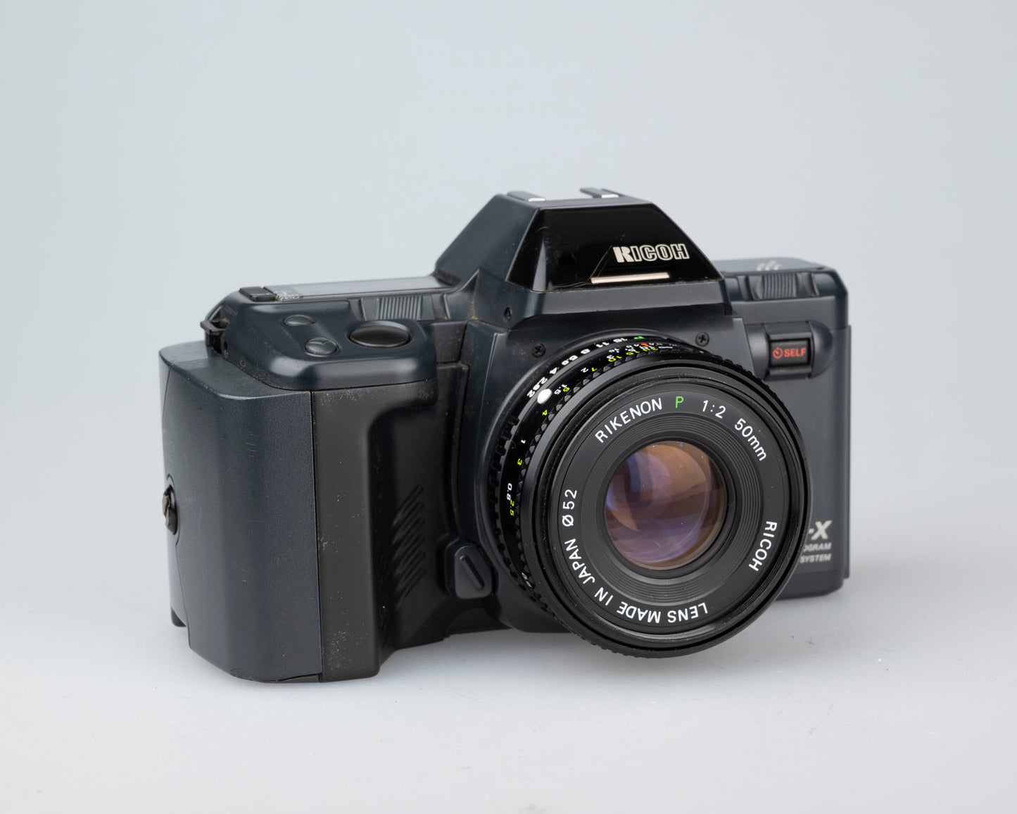 The Ricoh XR-X aka XR-M is a high-end, feature-rich 35mm SLR from 1988