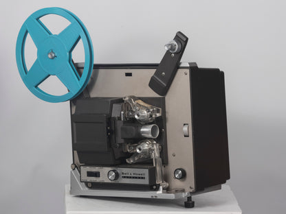 Bell and Howell Autoload 357 Super 8 movie projector. Shown with takeup reel..
