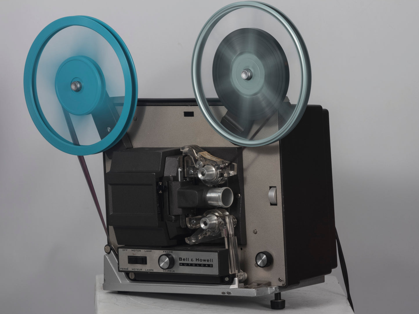 Bell and Howell Autoload 357 Super 8 movie projector. Shown operating.