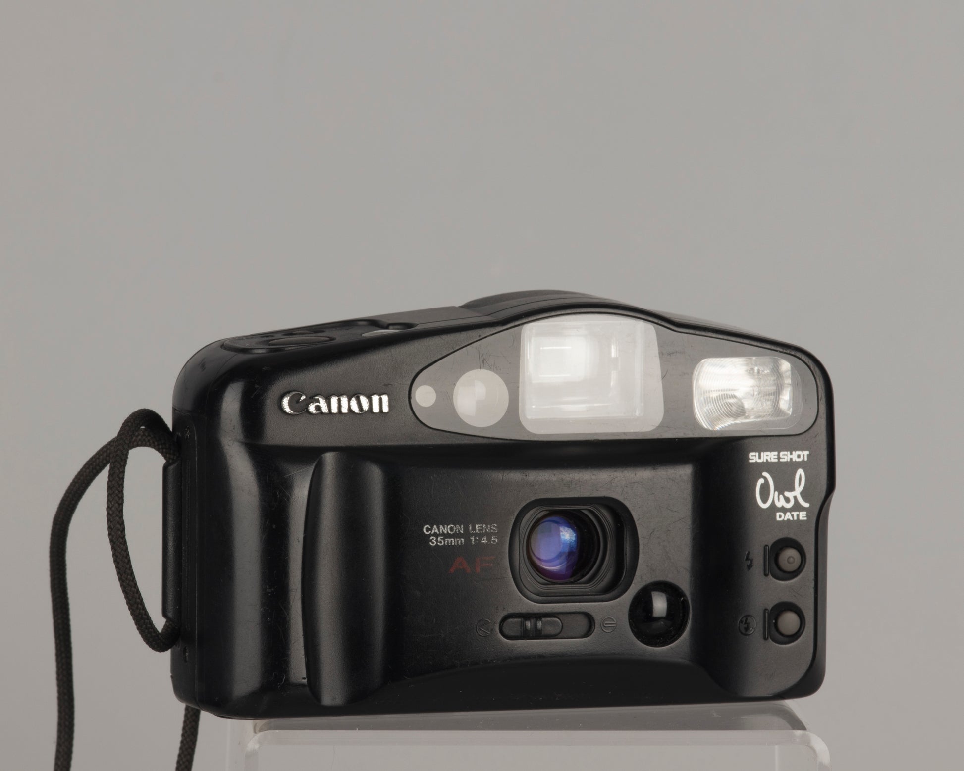 The Canon Sure Shot Owl Date is a 35mm point-and-shoot camera with a 35mm focal length lens