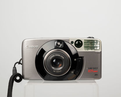 The Canon Sure Shot 105 Zoom is a high quality zoom point-and-shoot 35mm camera from the early aughts