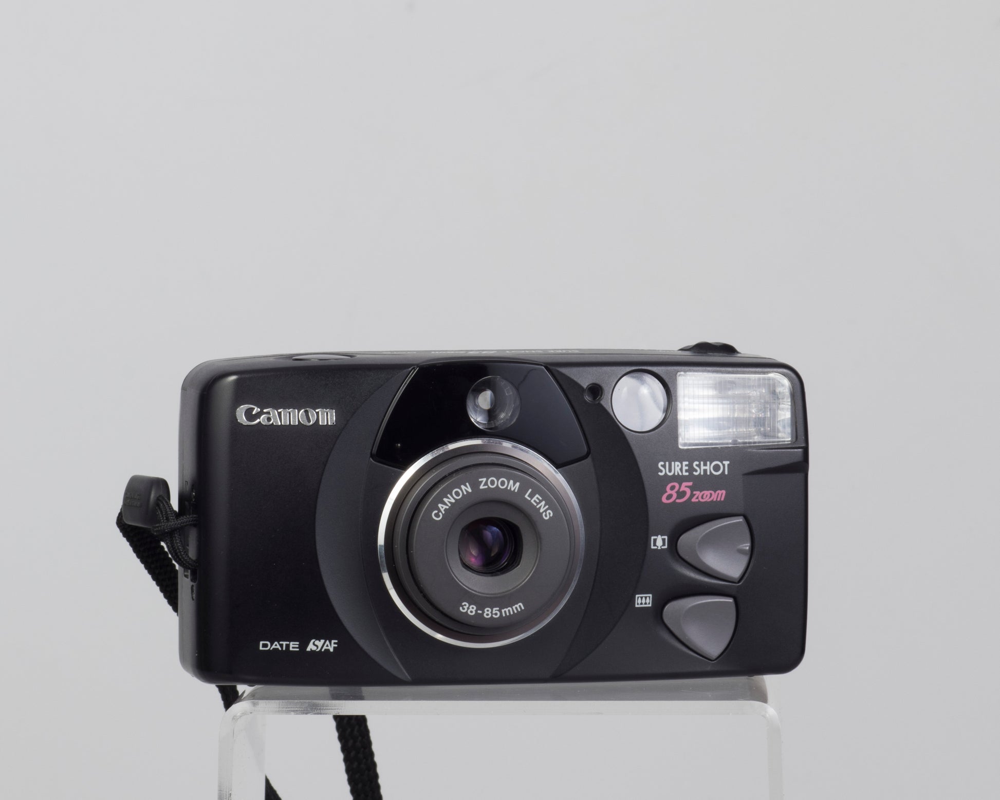 The Canon Sure Shot 85 Zoom Date is a high quality 35mm film point-and-shoot camera from the late 1990s.