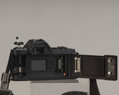 The Canon T50 35mm film SLR back view with film door open