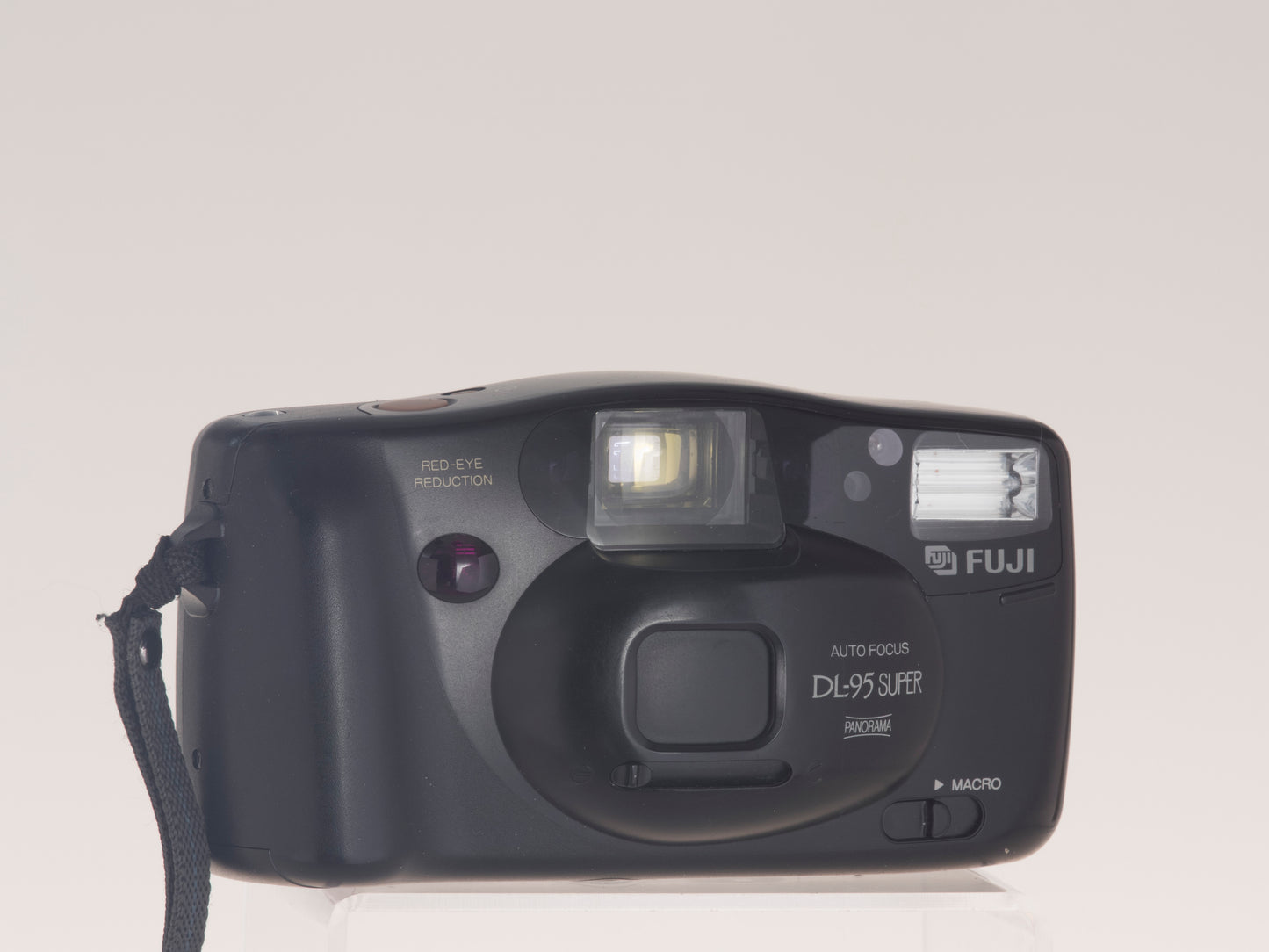 Fuji DL-95 Super autofocus 35mm film camera. Front view lens cap closed.