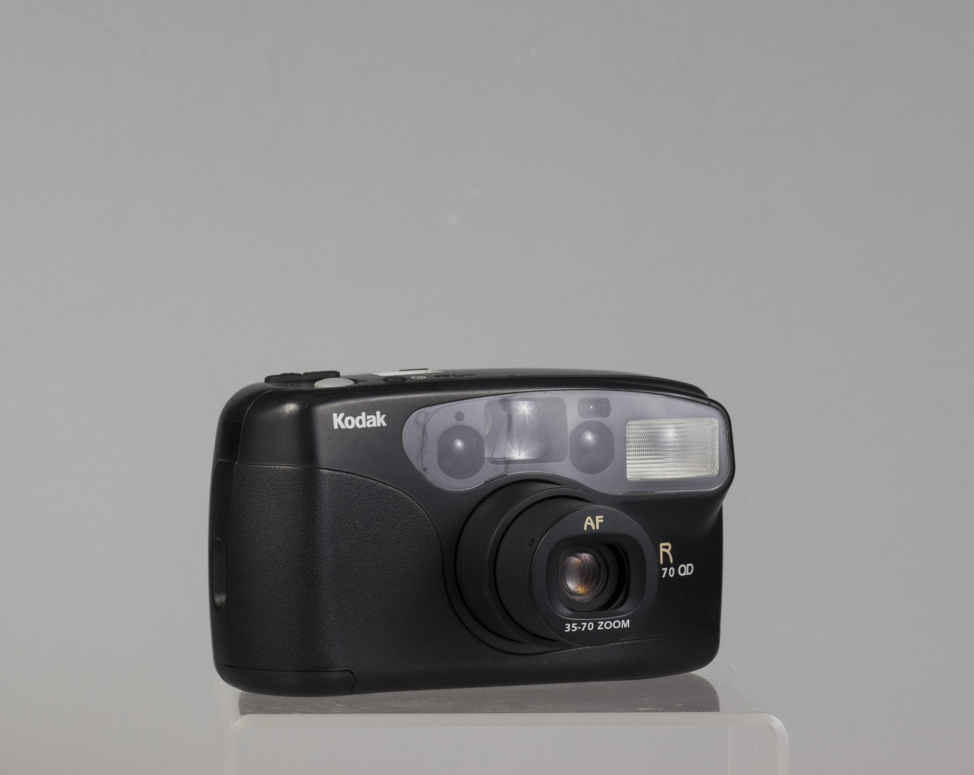 The Kodak Star Zoom 70 QD is a good quality 35mm point-and-shoot camera from the late 90s. We believe it was built by Chinon of Japan and is closely related to their Zoom 1000 camera.