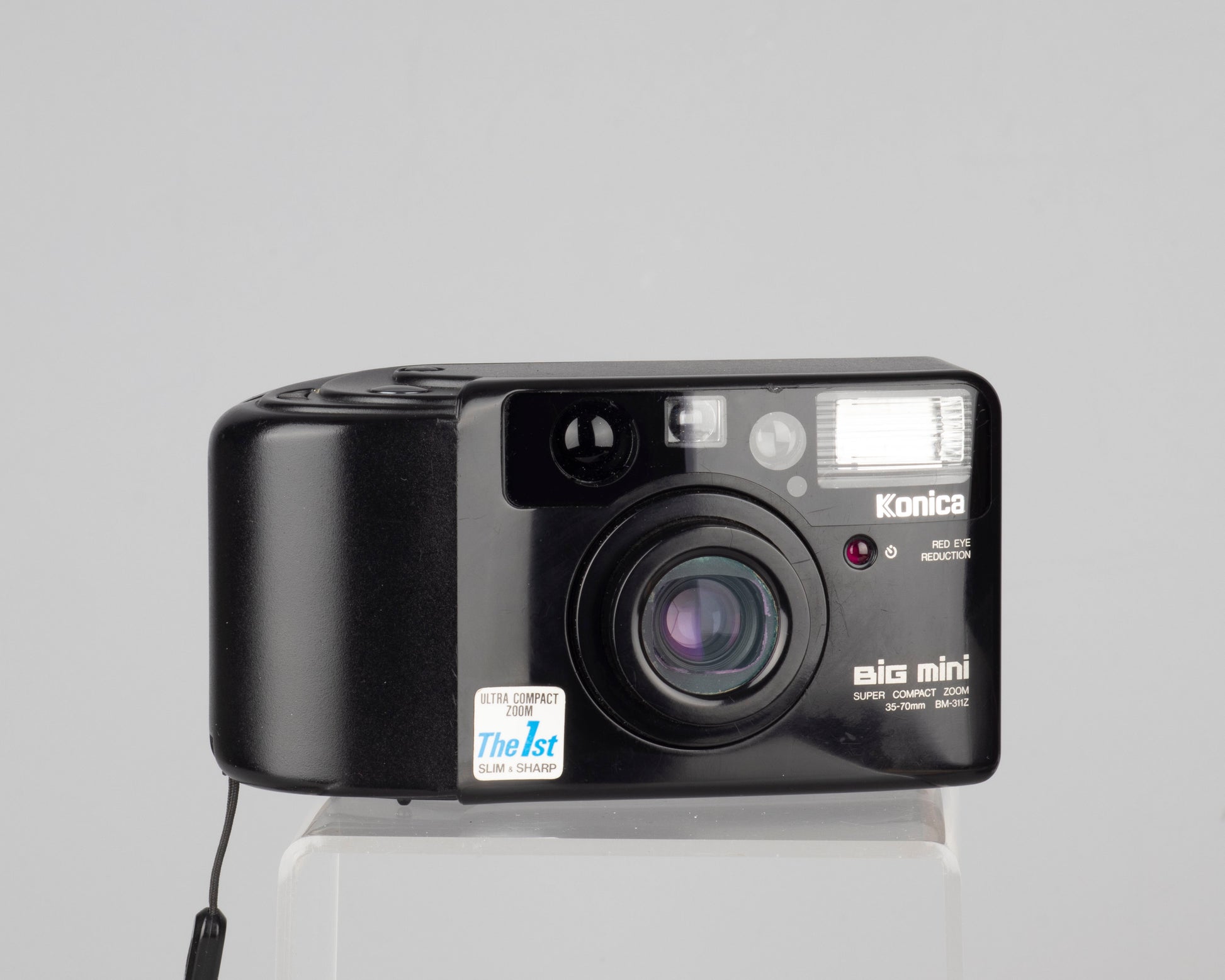 The Konica Big Mini MB-311Z is a quality 35mm point-and-shoot from 1992 featuring a 35-70mm zoom lens