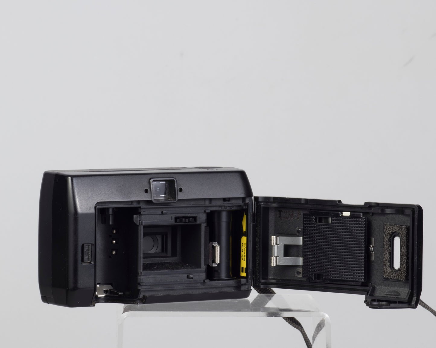 The Konica MT-100 is a 35mm point-and-shoot camera from 1989 (film door open)