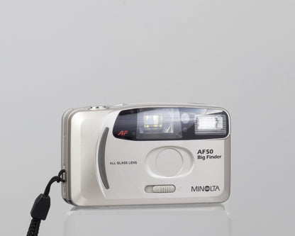 The Minolta AF50 Big Finder is an ultra-compact 35mm film camera from the 1990s (lens cover closed)