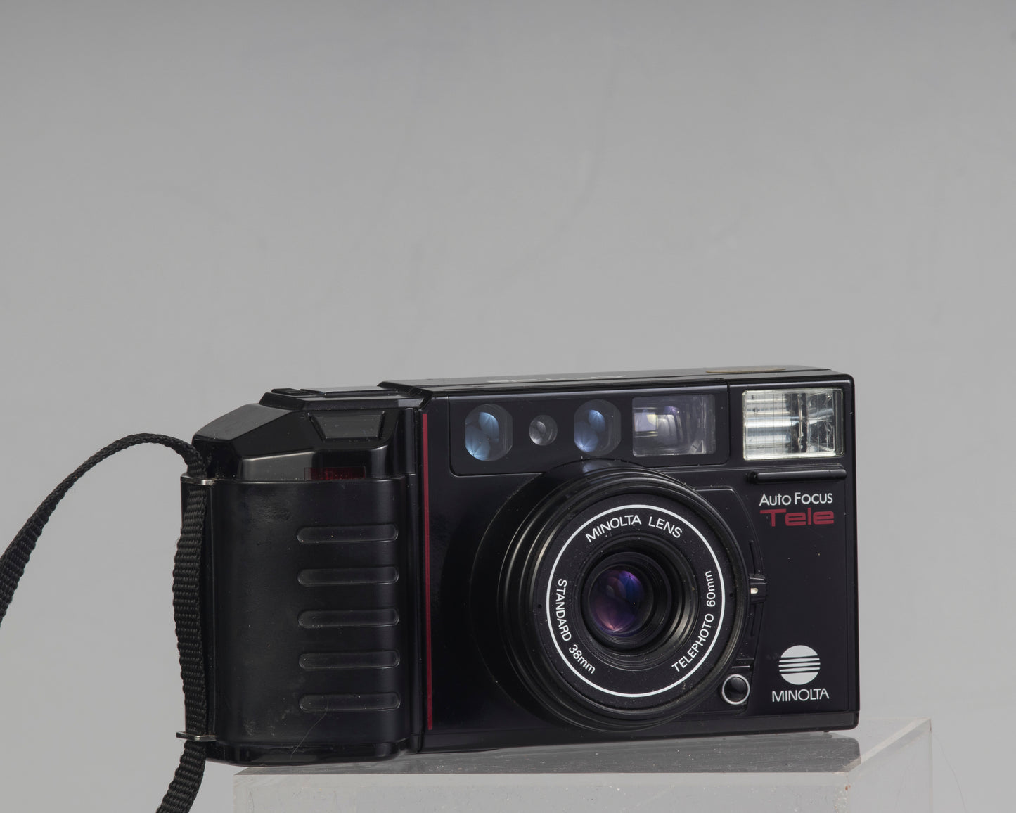 The Minolta AF Tele is an auto focus dual lens 35mm point-and-shoot camera from the mid 1980s