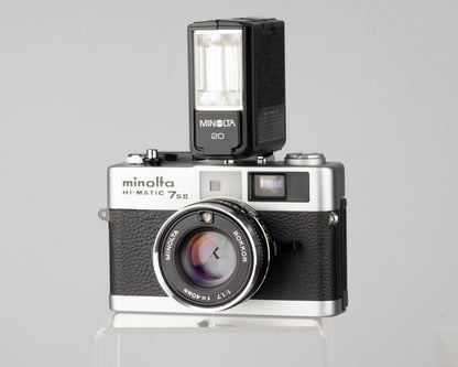 Minolta Hi-Matic 7SII 35mm rangefinder camera with half-case and Minolta 20 flash