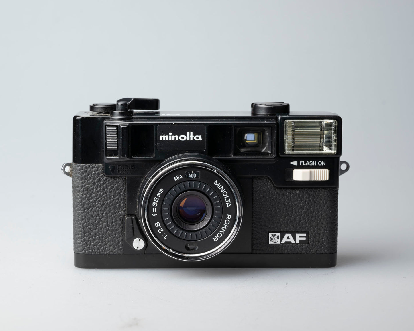 Minolta Hi-Matic AF 35mm camera w/ ever-ready case (serial 296583)
