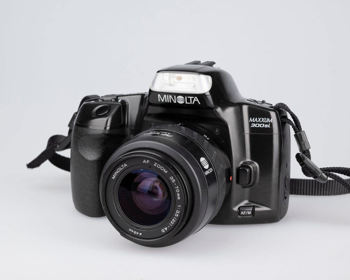 Minolta Maxxum 300si 35mm film SLR avec objectif 35-70mm + manuel
