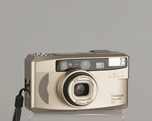 The Nikon One Touch Zoom 90 AF is a compact 35mm film camera with a 38-90mm lens with macro capability