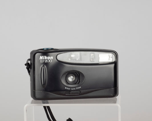 The Nikon EF200 (aka Nice Touch 2) is a simple point-and-shoot from the 1990s featuring a 31mm wide angle lens