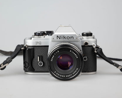 Nikon FG 35mm film SLR camera with 50mm f1.8 lens and ever-ready case