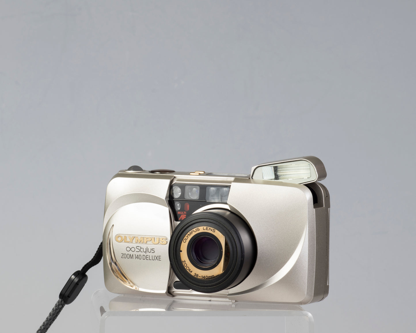 Olympus ∞ Stylus Zoom 140 Deluxe  35mm film camera (serial 4014772)