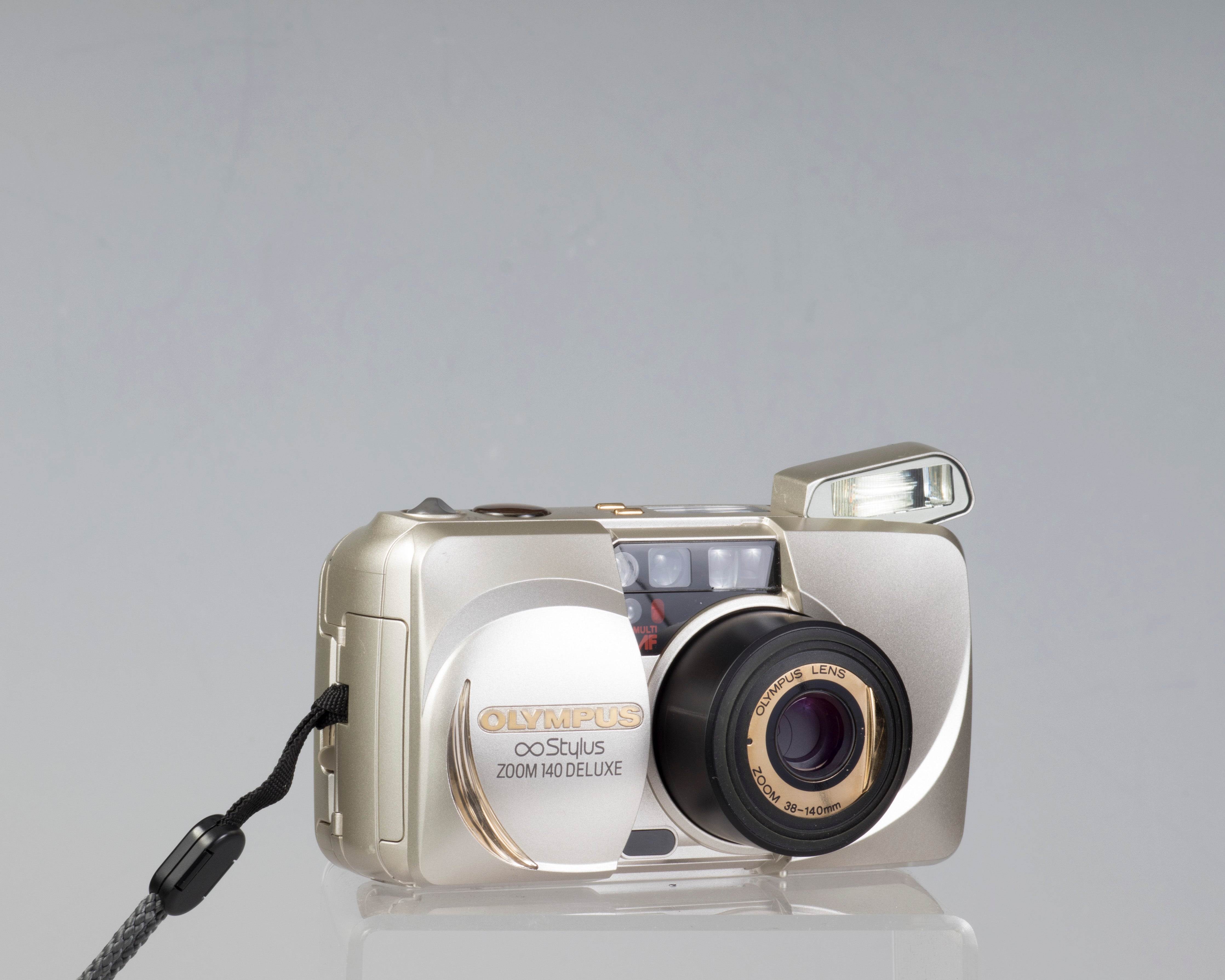 Olympus ∞ Stylus Zoom 140 Deluxe 35mm film camera (serial 4014772)