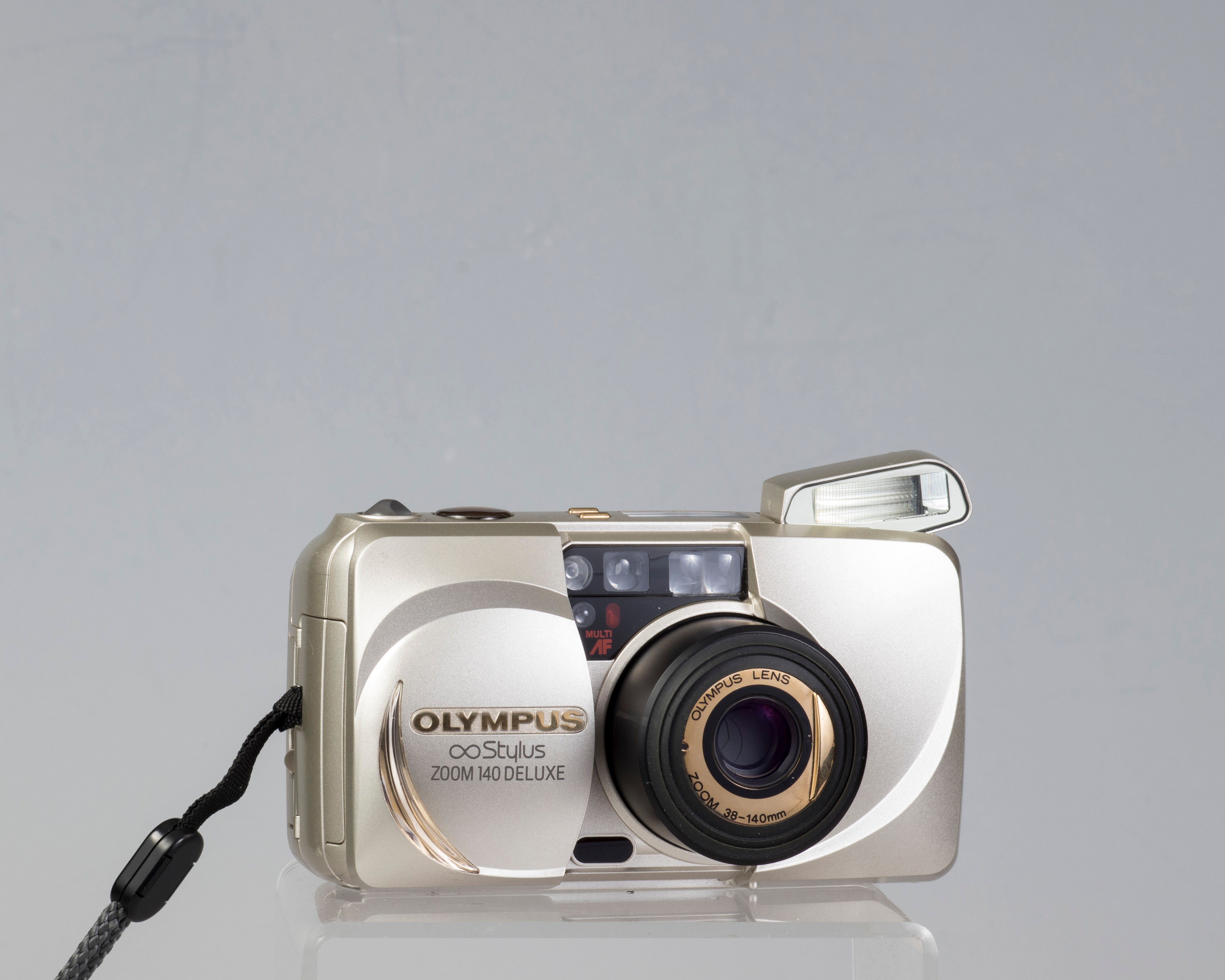 Olympus ∞ Stylus Zoom 140 Deluxe 35mm film camera (serial