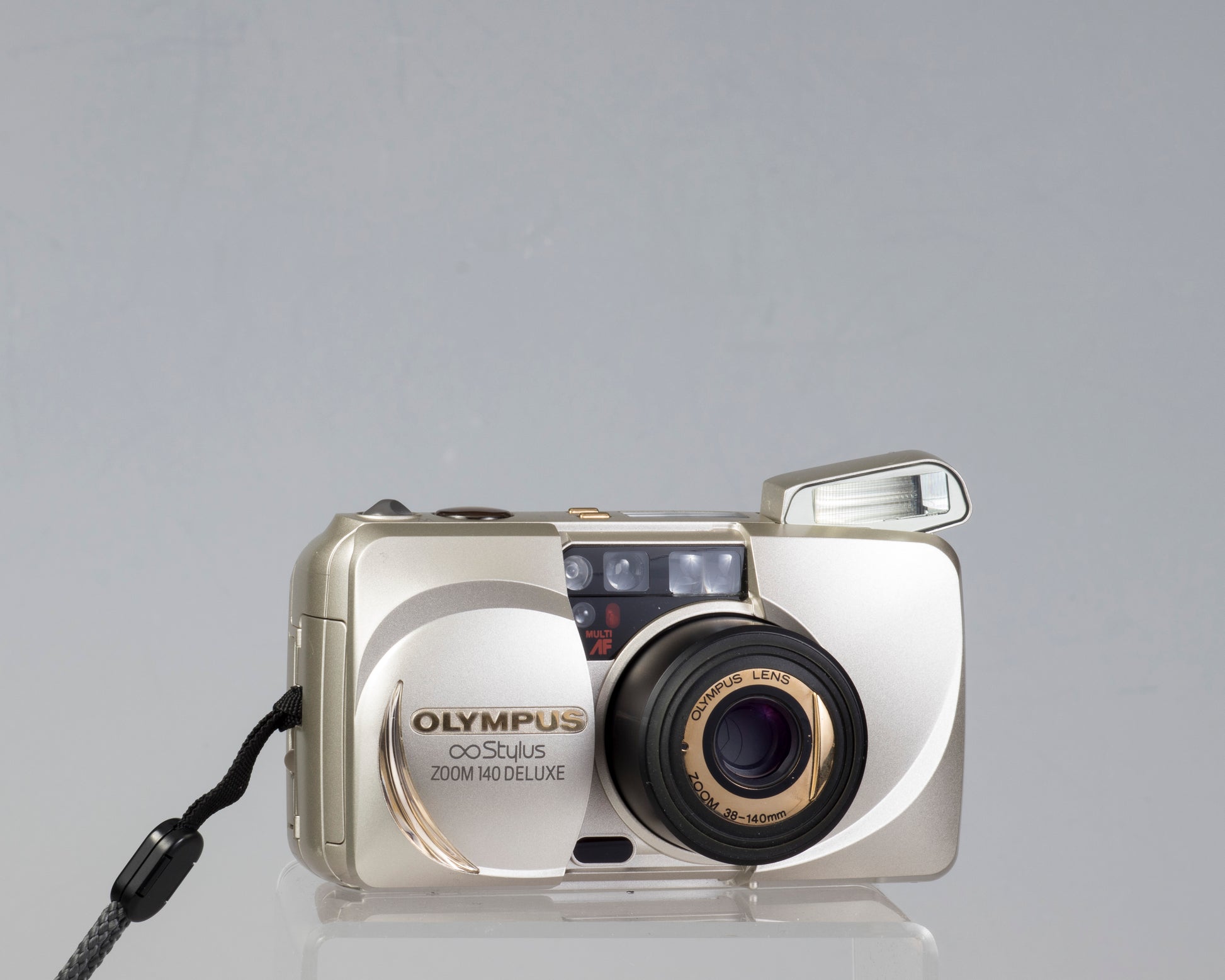 Olympus ∞ Stylus Zoom 140 Deluxe 35mm film camera (serial 4014772
