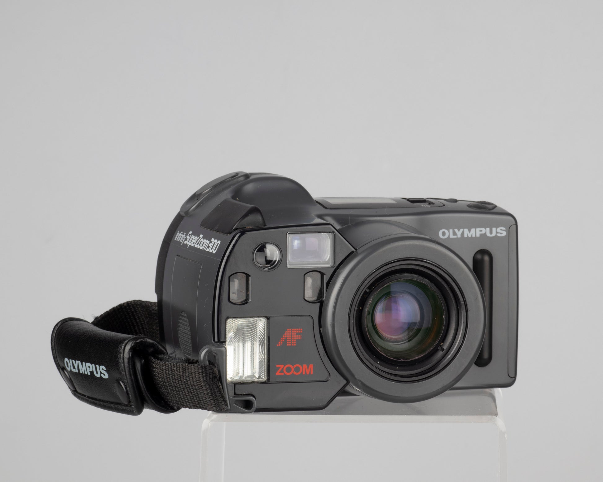 The Olympus Infinity SuperZoom 300 is one of original 35mm 'bridge' cameras--offering point-and-shoot ease of use with the advanced optics and features typically found in an SLR