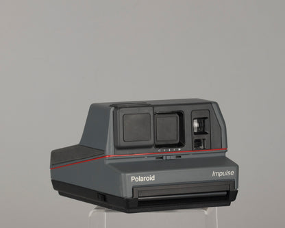 Polaroid Impulse instant camera with original case, prism lens filter, box, and manual