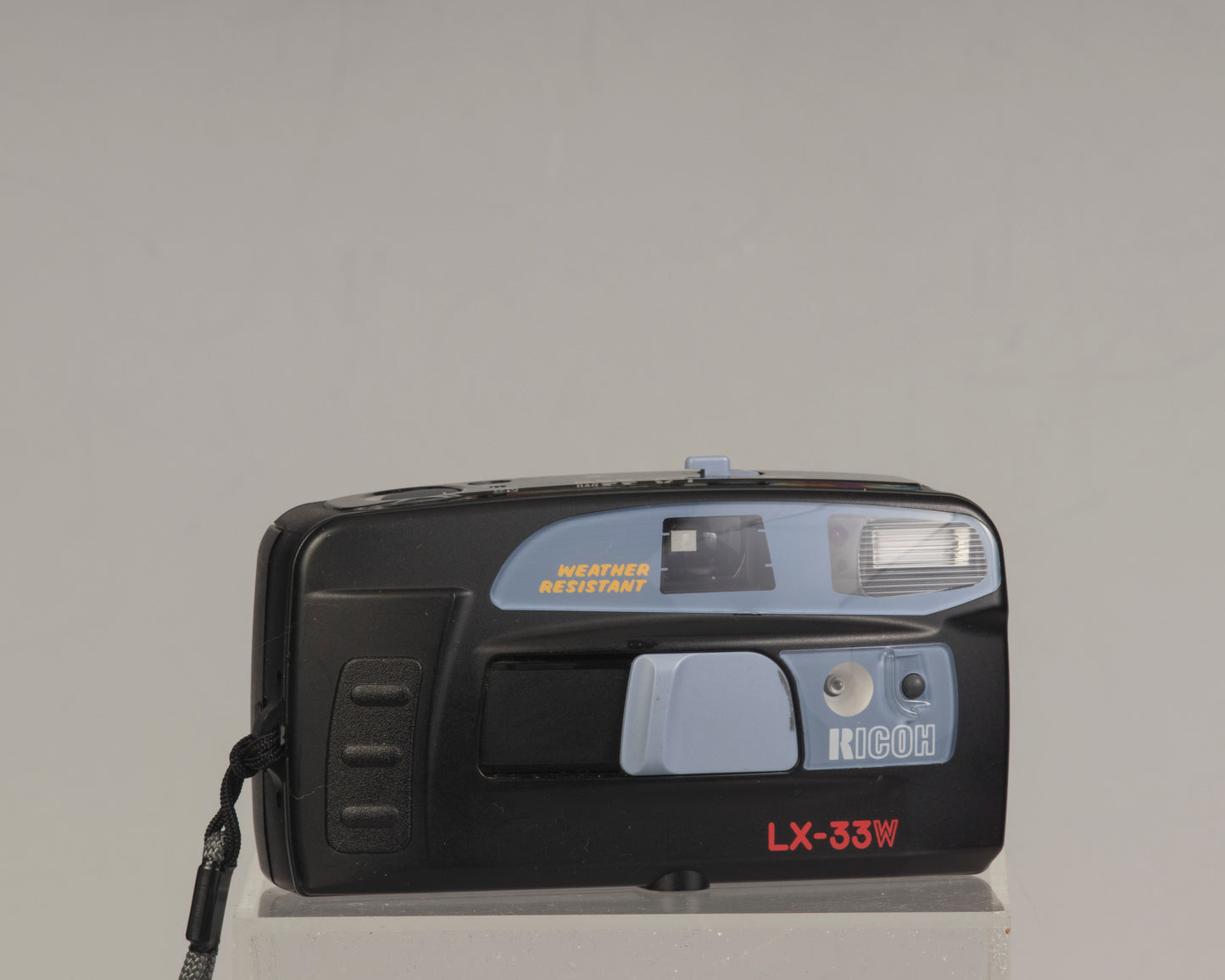 The Ricoh LX-33W is a simple weather-resistant 35mm film point-and-shoot camera from the 1990s