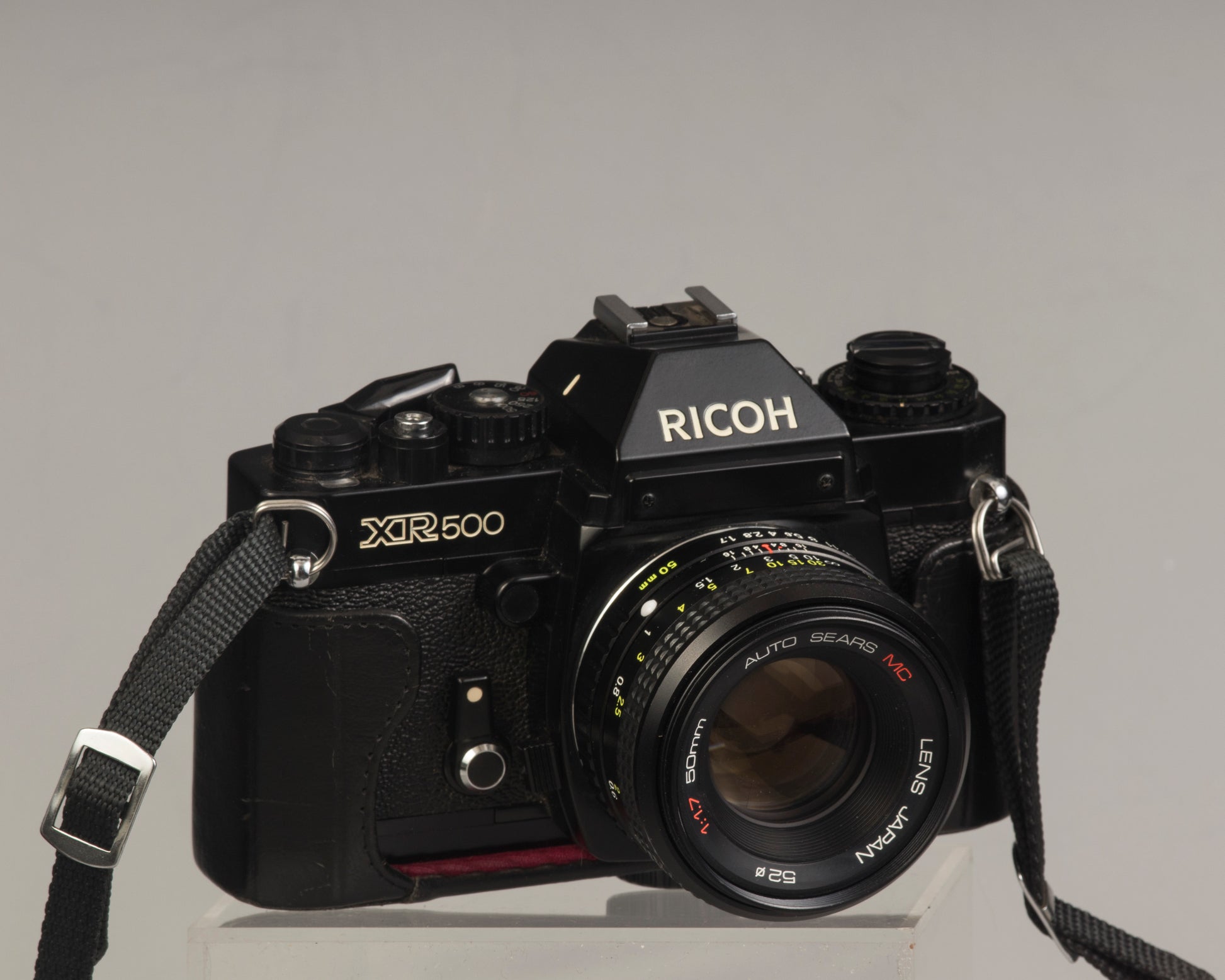 Ricoh XR-500 (aka KR-5) with Auto Sears MC 50mm f1.7 (a rebranded Ricoh lens); in half-case