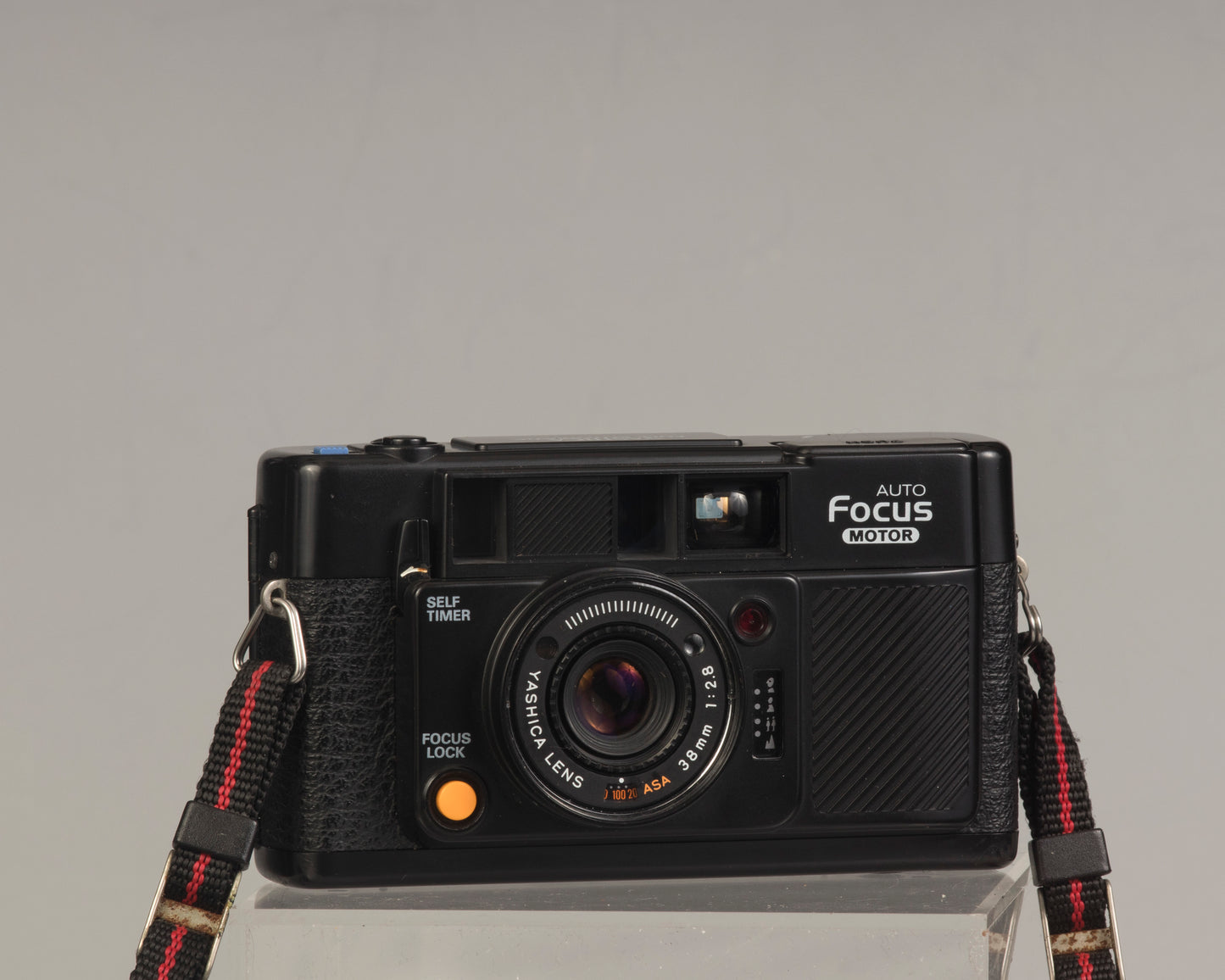 The Yashica Auto Focus Motor is a classic 35mm point-and-shoot film camera featuring a 38mm f2.8 lens