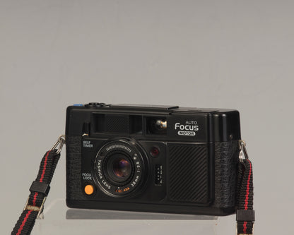 The Yashica Auto Focus Motor (shown in half-case) is a classic 35mm point-and-shoot film camera featuring a 38mm f2.8 lens