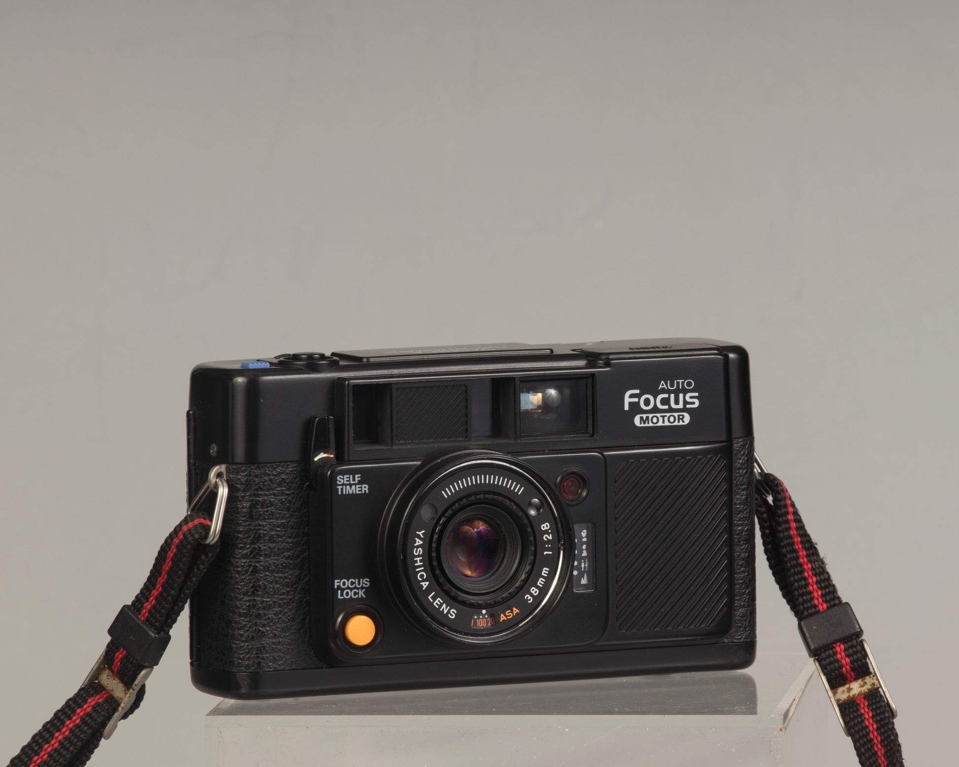 The Yashica Auto Focus Motor is a classic 35mm point-and-shoot film camera featuring a 38mm f2.8 lens