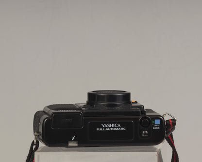 The Yashica Auto Focus Motor (top view shown) is a classic 35mm point-and-shoot film camera featuring a 38mm f2.8 lens
