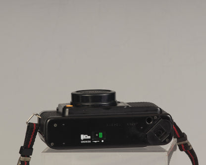 The Yashica Auto Focus Motor (bottom view shown) is a classic 35mm point-and-shoot film camera featuring a 38mm f2.8 lens