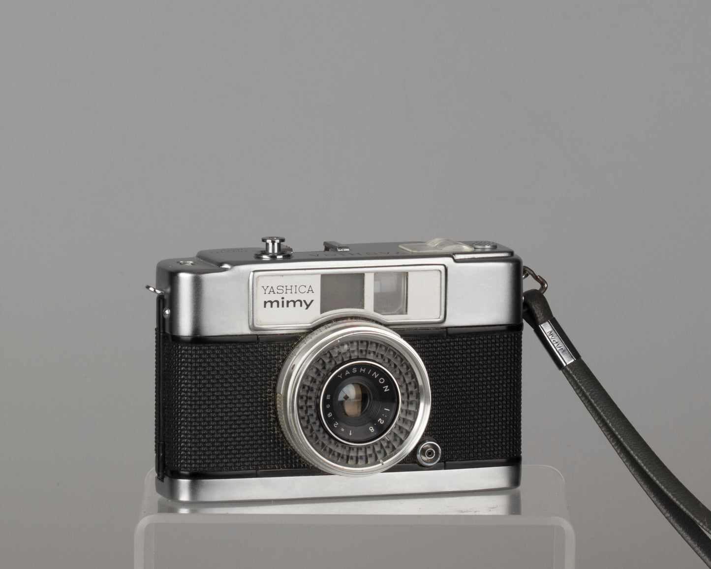 Yashica Mimy half-frame 35mm camera plus Braun flash