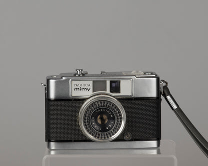 Yashica Mimy half-frame 35mm camera plus Braun flash